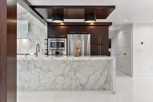 a view of kitchen with cabinets