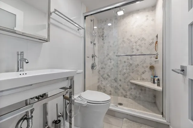 a bathroom with a sink a toilet and a bathtub