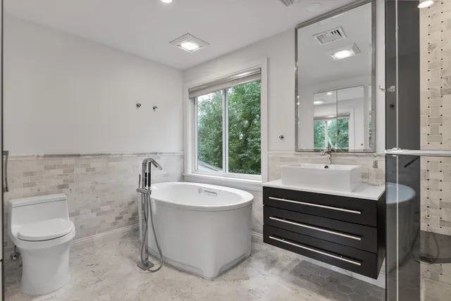 a bathroom with a shower and a sink