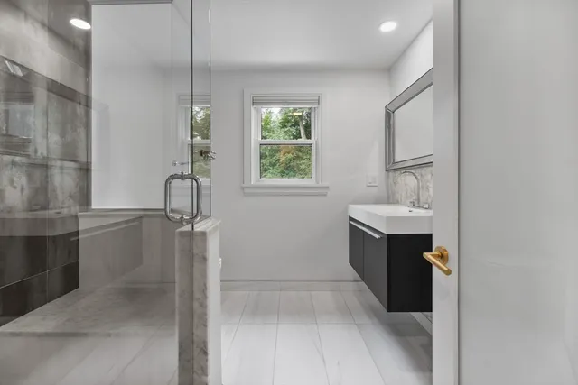 a large bedroom with a bed and a fireplace