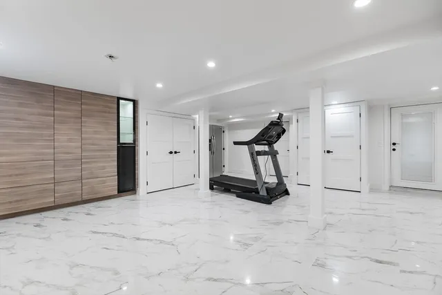 a spacious bedroom with a bed and walk in closet