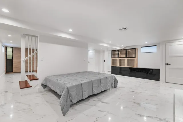 a front view of house with yard and trees