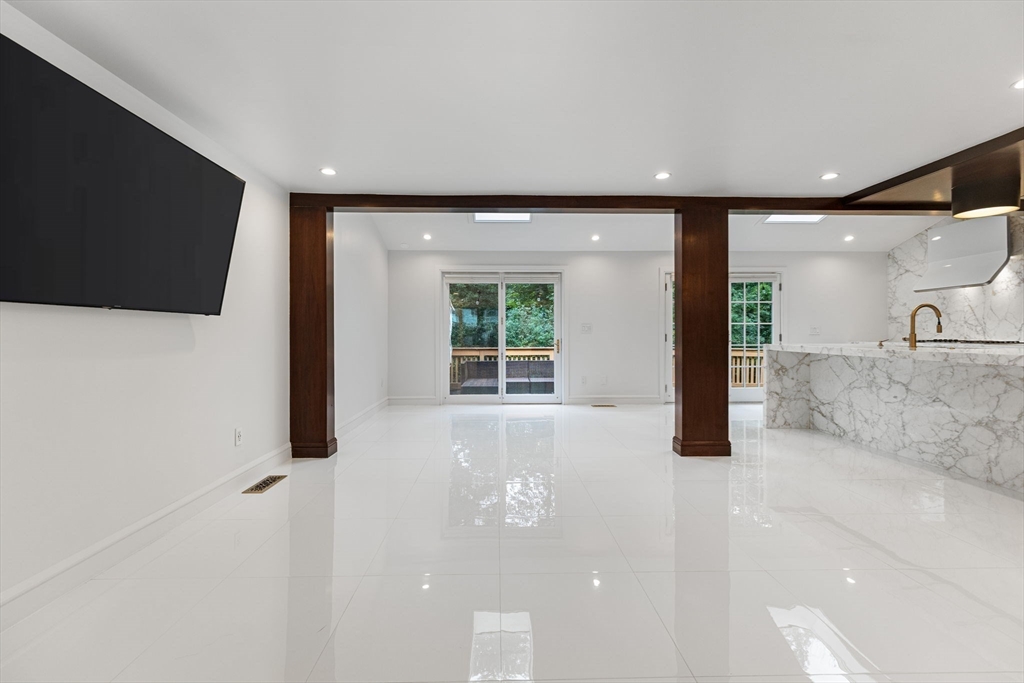 4 Hadley Road Lexington, MA 02420 - Photo 3 of 35 a view of an empty room with a window