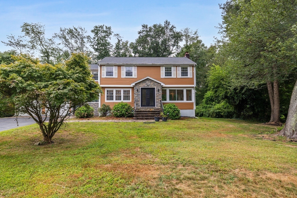 4 Hadley Road Lexington, MA 02420 - Photo 31 of 35 a front view of house with yard and trees