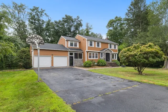 a front view of a house with a yard