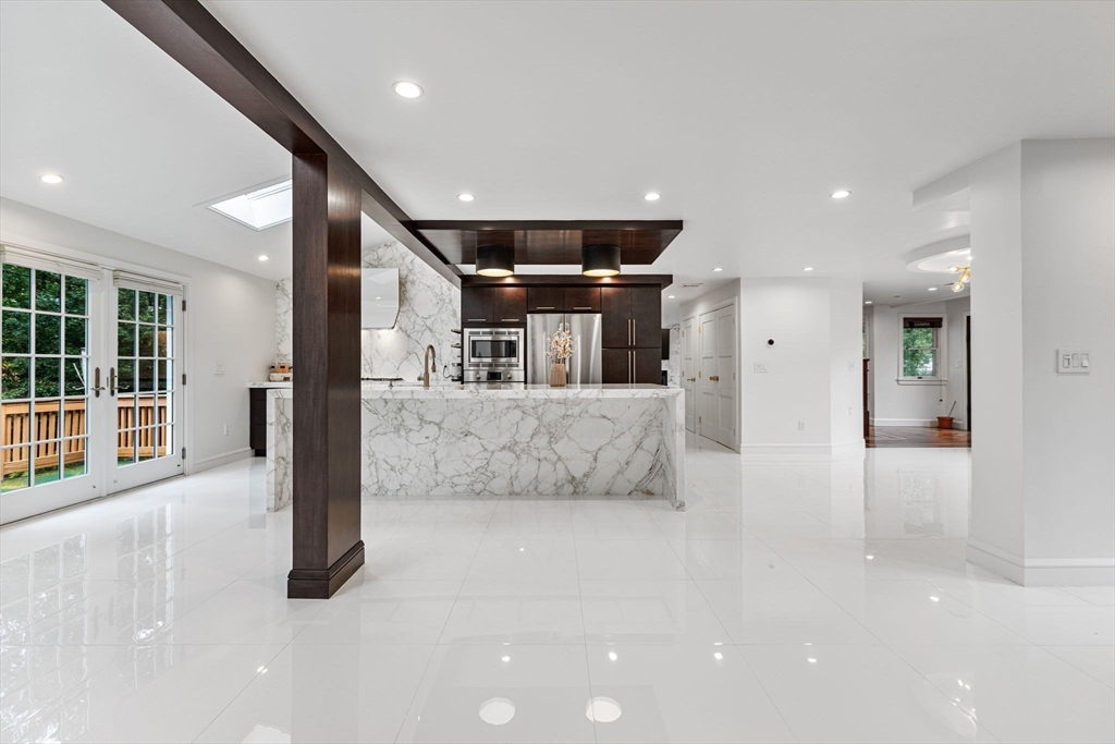 4 Hadley Road Lexington, MA 02420 - Photo 4 of 35 a view of a big room with large windows