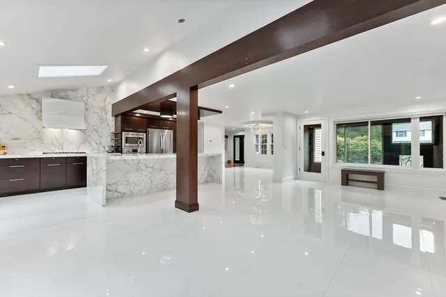 a lobby with furniture and a large window