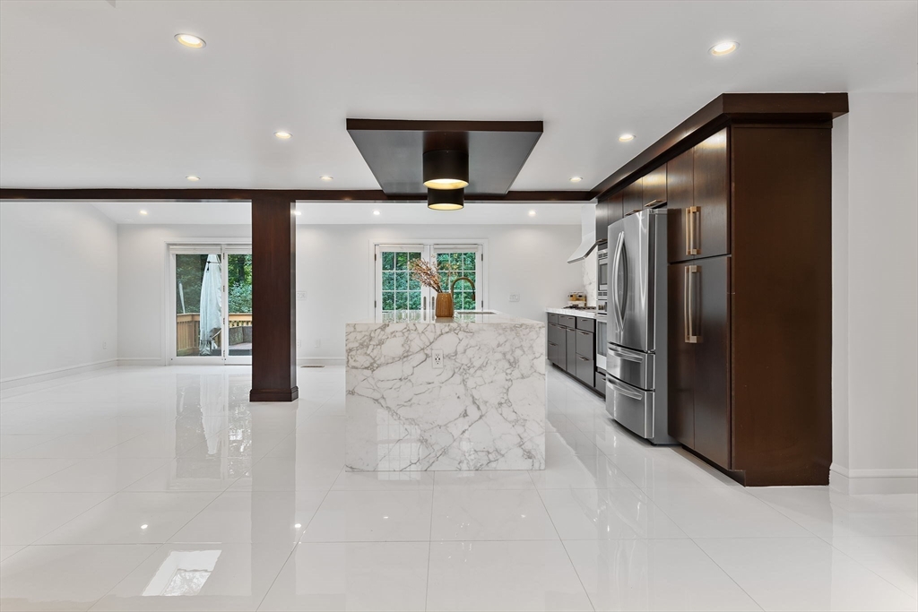 4 Hadley Road Lexington, MA 02420 - Photo 7 of 35 a view of a hallway with wooden floor windows and entryway