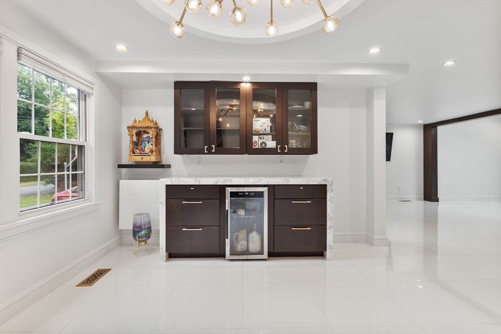 4 Hadley Road Lexington, MA 02420 - Photo 8 of 35 a living room with stainless steel appliances kitchen island a cabinets and a fireplace