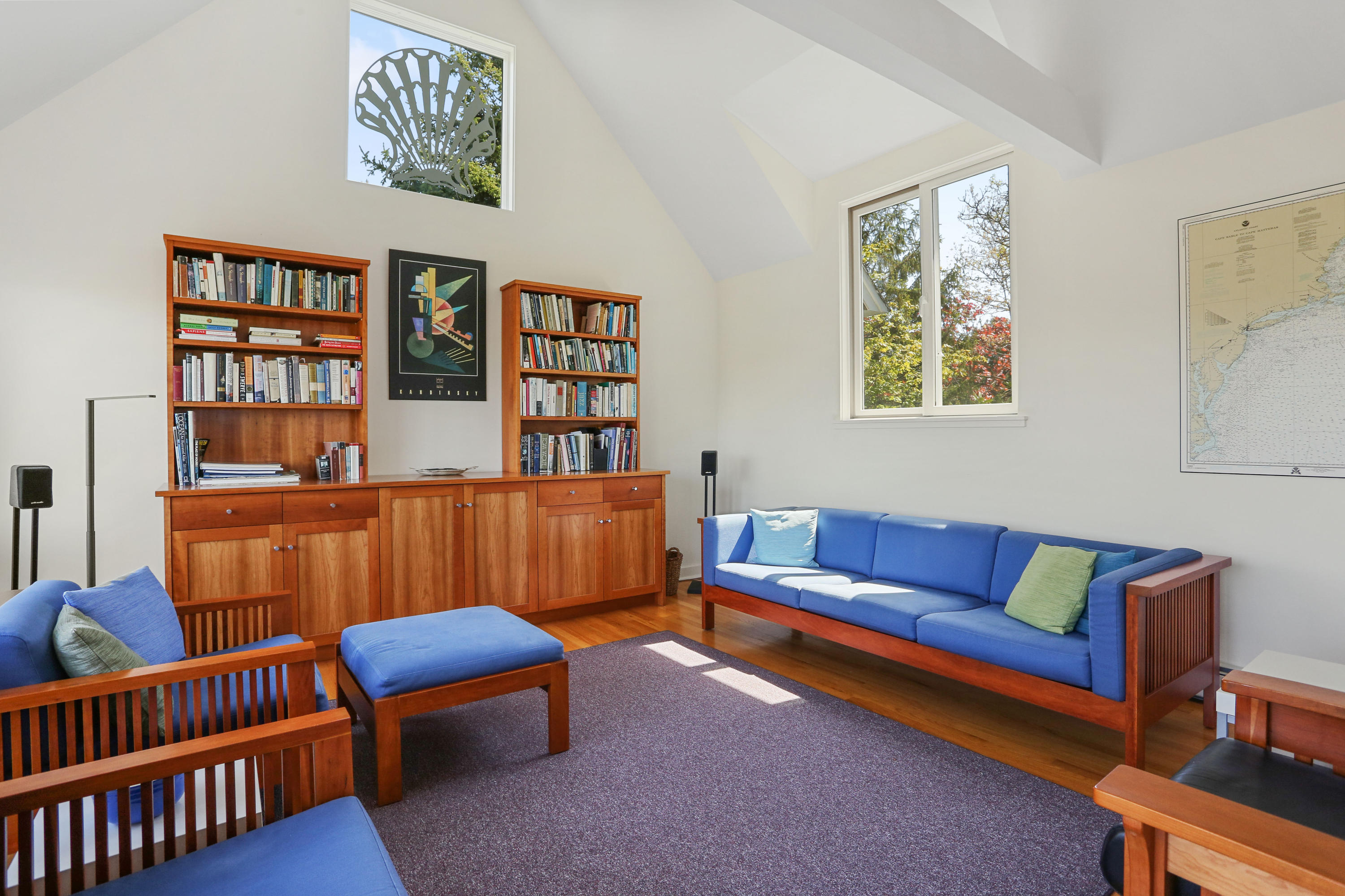17 Hart Road Truro, MA 02666 - Photo 8 of 42 a blue room with furniture and a book shelf