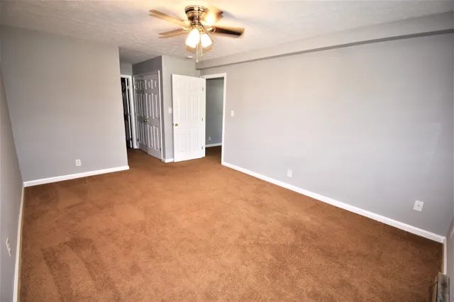 a view of a hallway with windows