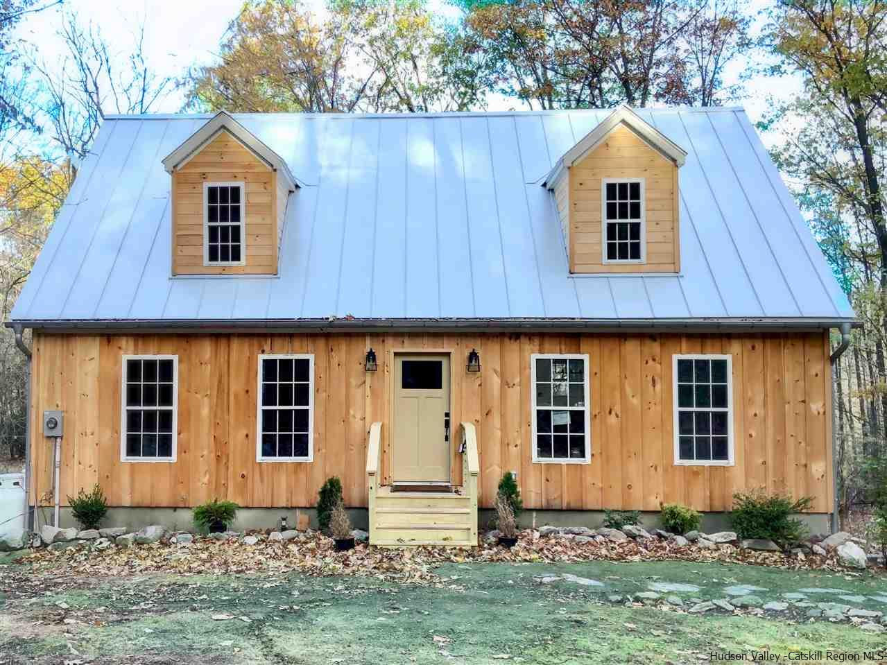 a view of front a house with a yard