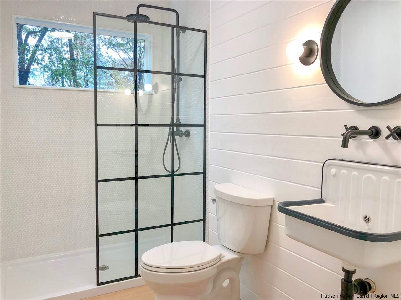 25 Laurel Hollow Road Kerhonkson, NY 12446 - Photo 14 of 30 a bathroom with a toilet and a shower