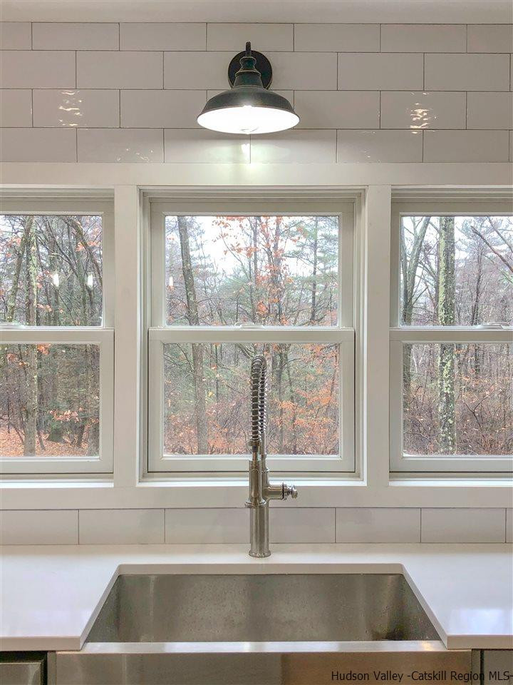 25 Laurel Hollow Road Kerhonkson, NY 12446 - Photo 7 of 30 a kitchen with a window and a sink
