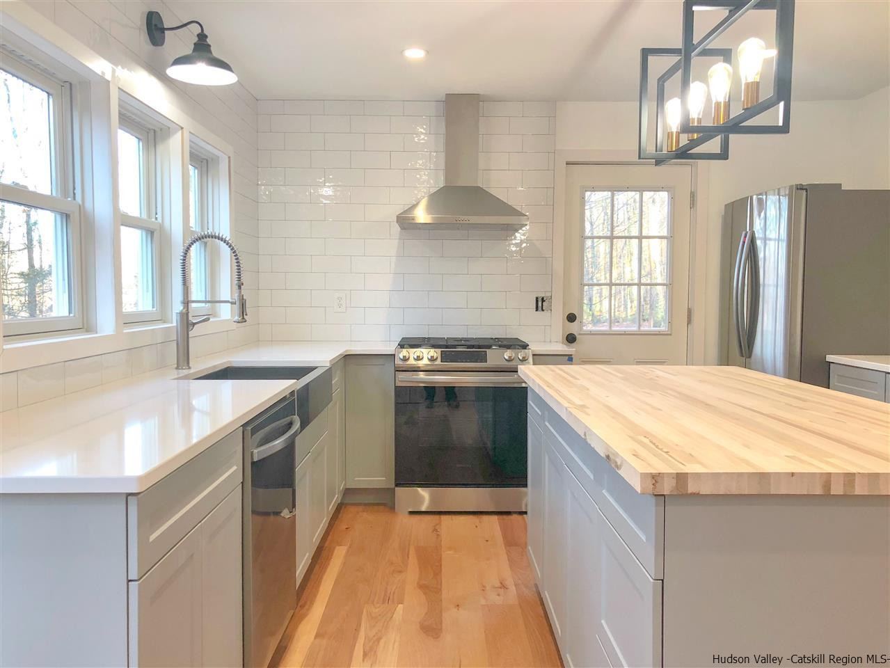 25 Laurel Hollow Road Kerhonkson, NY 12446 - Photo 8 of 30 a large kitchen with granite countertop a stove and a sink