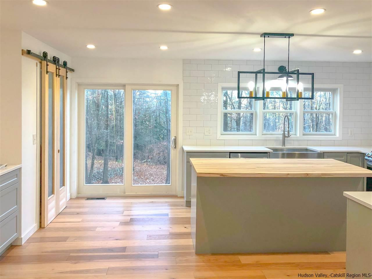25 Laurel Hollow Road Kerhonkson, NY 12446 - Photo 10 of 30 a view of a kitchen with a sink and wooden floor