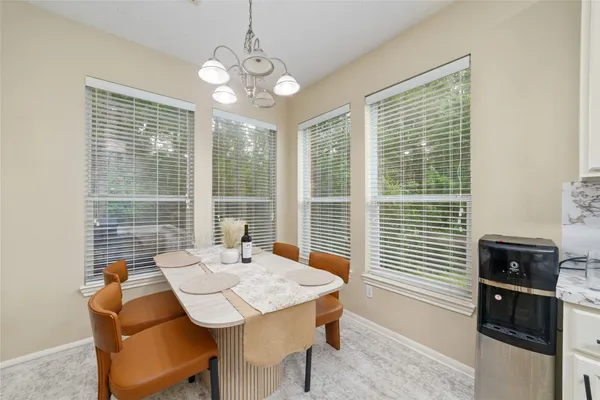 a view of a dining room with furniture window and outside view