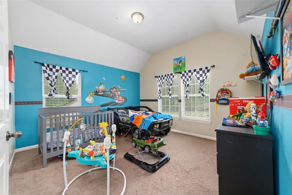 a bedroom with furniture and toys