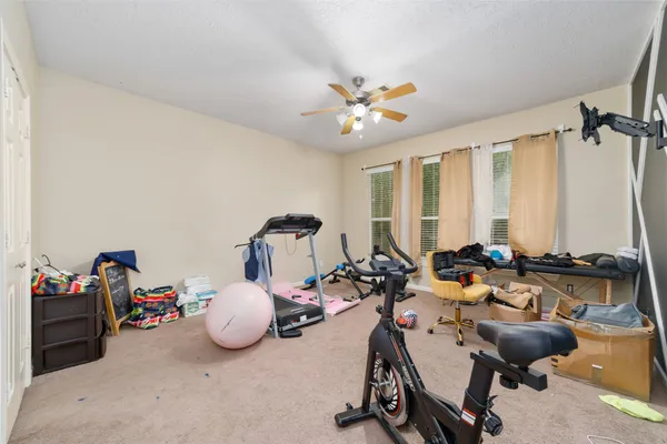 a room with furniture and a large window