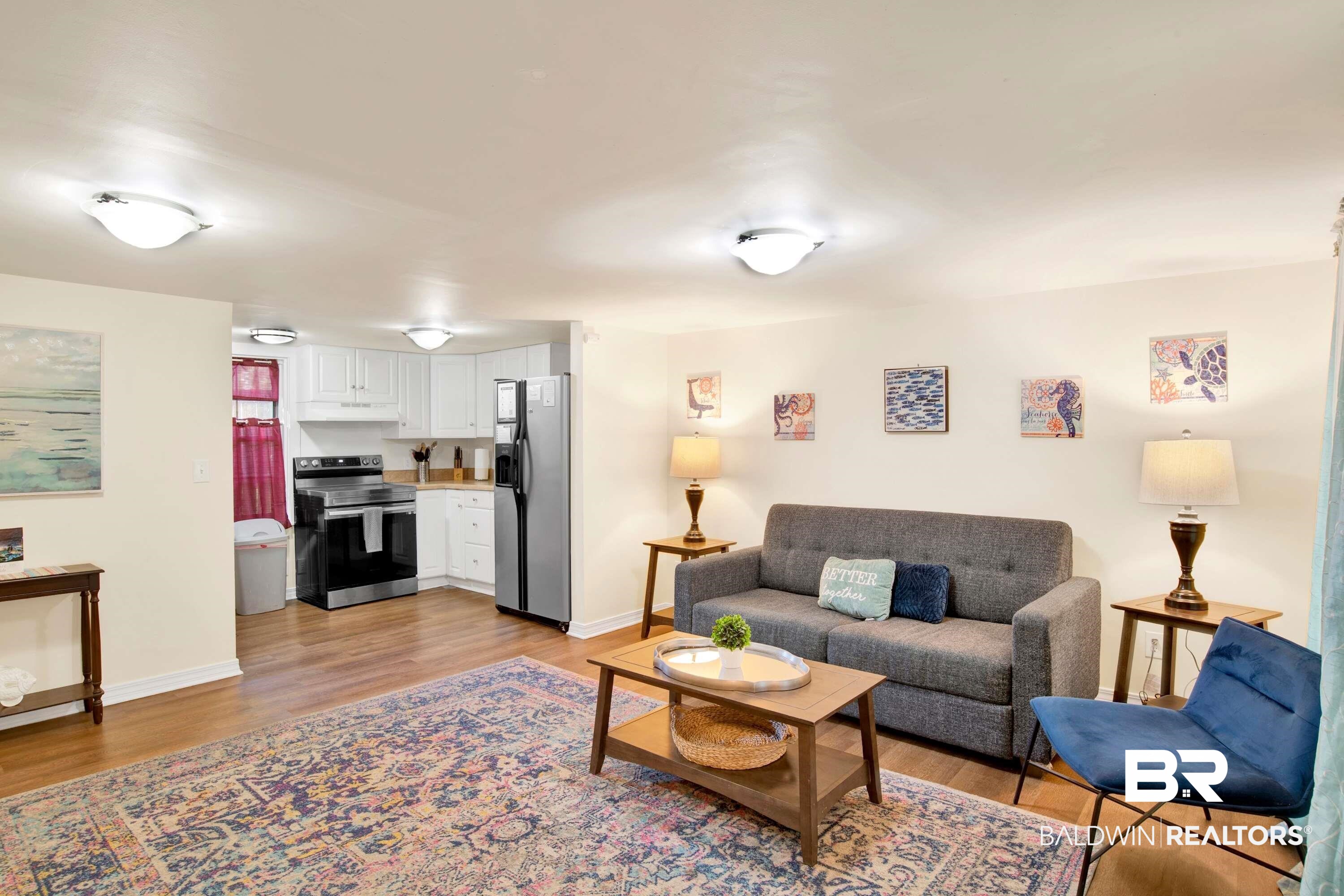 1141 Montauk Avenue Mobile, AL 36604 - Photo 5 of 15 Living room featuring light wood-style flooring and baseboards