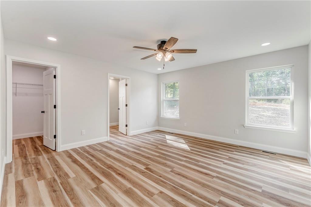 22 Earls Way Chatsworth, GA 30705 - Photo 11 of 64 a view of empty room with wooden floor and fan