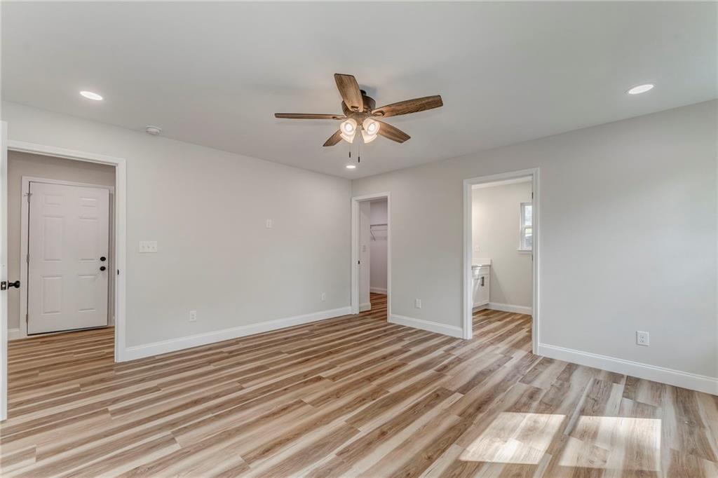 22 Earls Way Chatsworth, GA 30705 - Photo 13 of 64 wooden floor in an empty room with a window