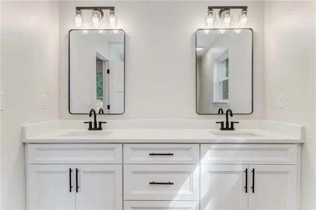 a view of a livingroom with a workspace hardwood floor and a ceiling fan