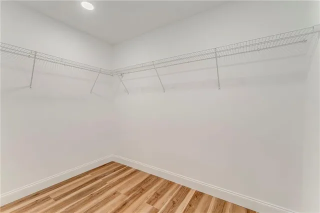 a large kitchen with stainless steel appliances granite countertop a stove and a sink