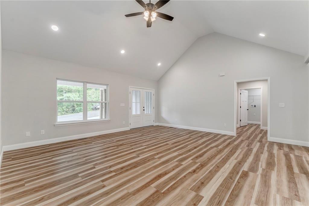 22 Earls Way Chatsworth, GA 30705 - Photo 24 of 64 a view of a livingroom with a workspace hardwood floor and a ceiling fan