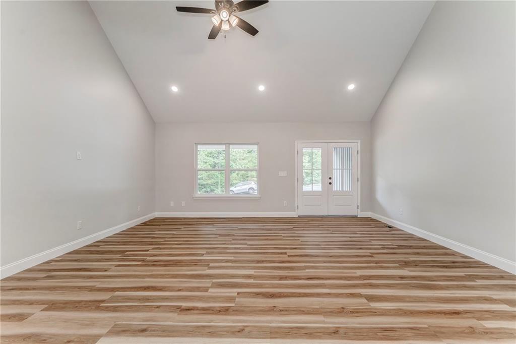 22 Earls Way Chatsworth, GA 30705 - Photo 25 of 64 a view of an empty room with a window and wooden floor