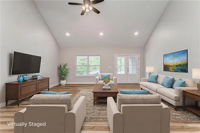 a kitchen with kitchen island white cabinets and stainless steel appliances