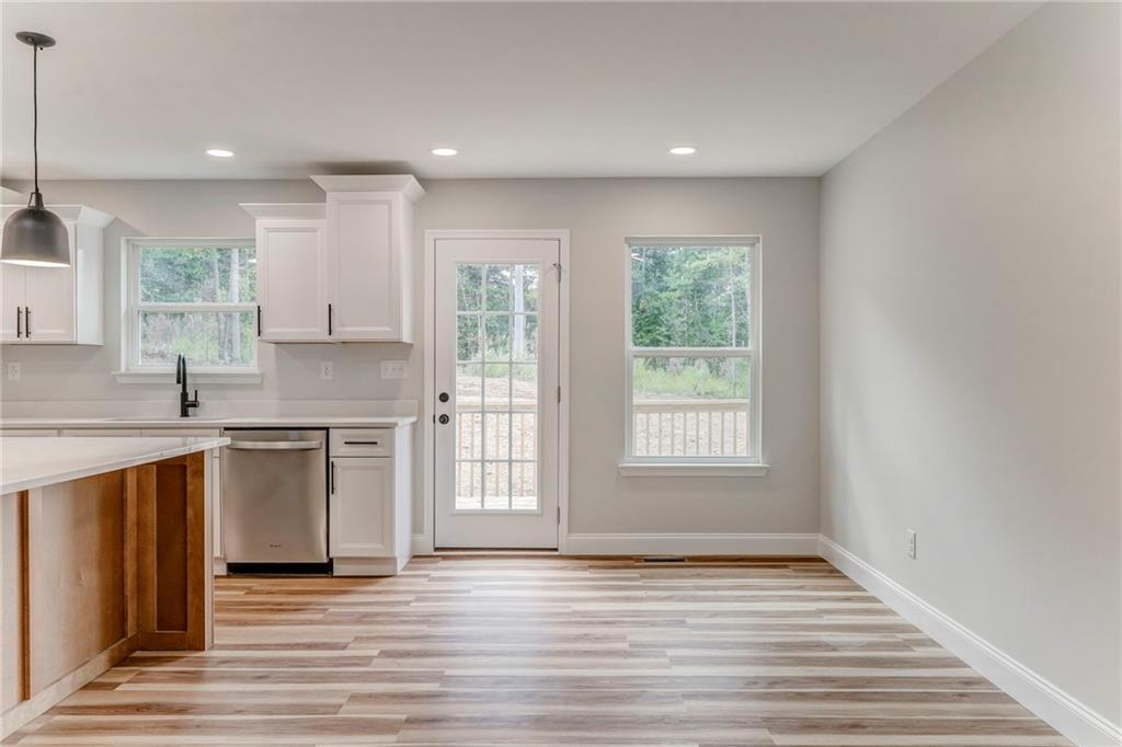 22 Earls Way Chatsworth, GA 30705 - Photo 29 of 64 a view of a kitchen with a sink dishwasher and wooden floor