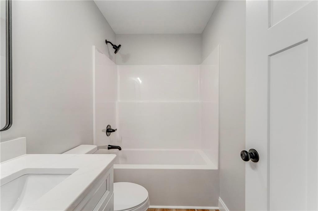 22 Earls Way Chatsworth, GA 30705 - Photo 47 of 64 a bathroom with a sink toilet and shower