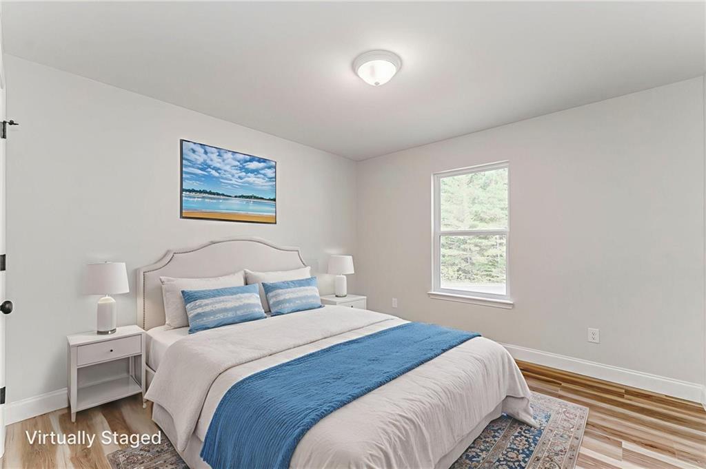 22 Earls Way Chatsworth, GA 30705 - Photo 49 of 64 a bedroom with a bed and a painting on the wall