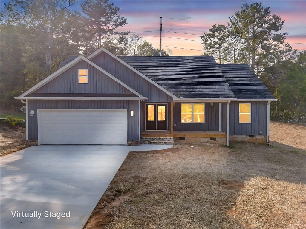 22 Earls Way Chatsworth, GA 30705 - Photo 10 of 64 a front view of a house with a yard and garage
