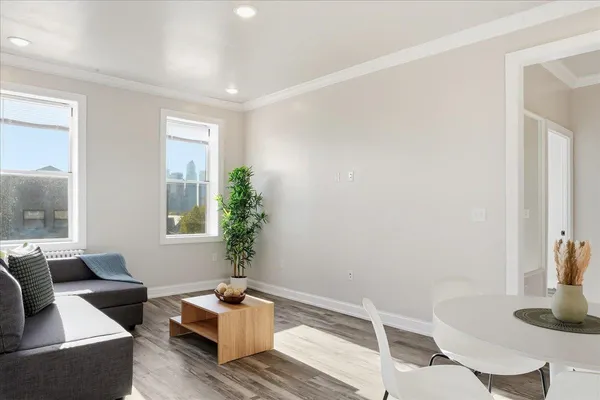 a view of a dining room with furniture and wooden floor