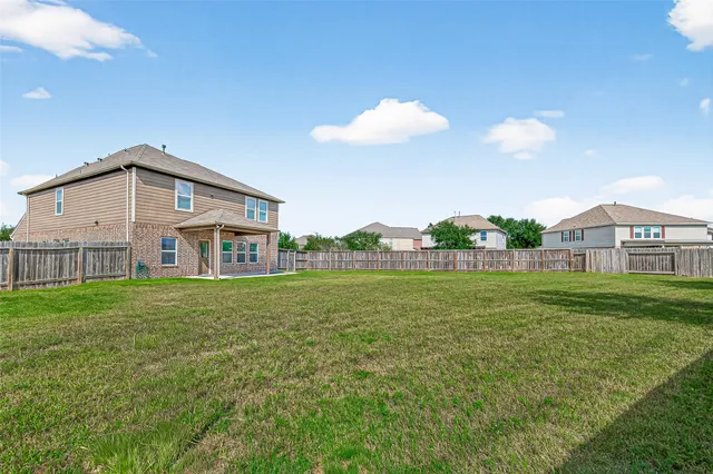 a view of a house with a big yard