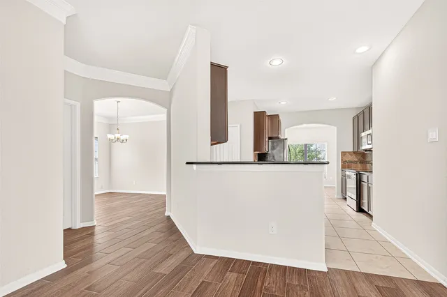 a view of kitchen with furniture and wooden floor