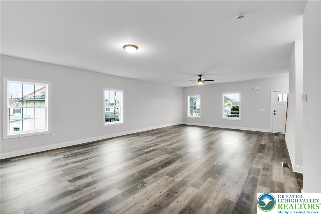 6 West 1st Street Northampton, PA 18067 - Photo 11 of 45 an empty room with wooden floor and windows