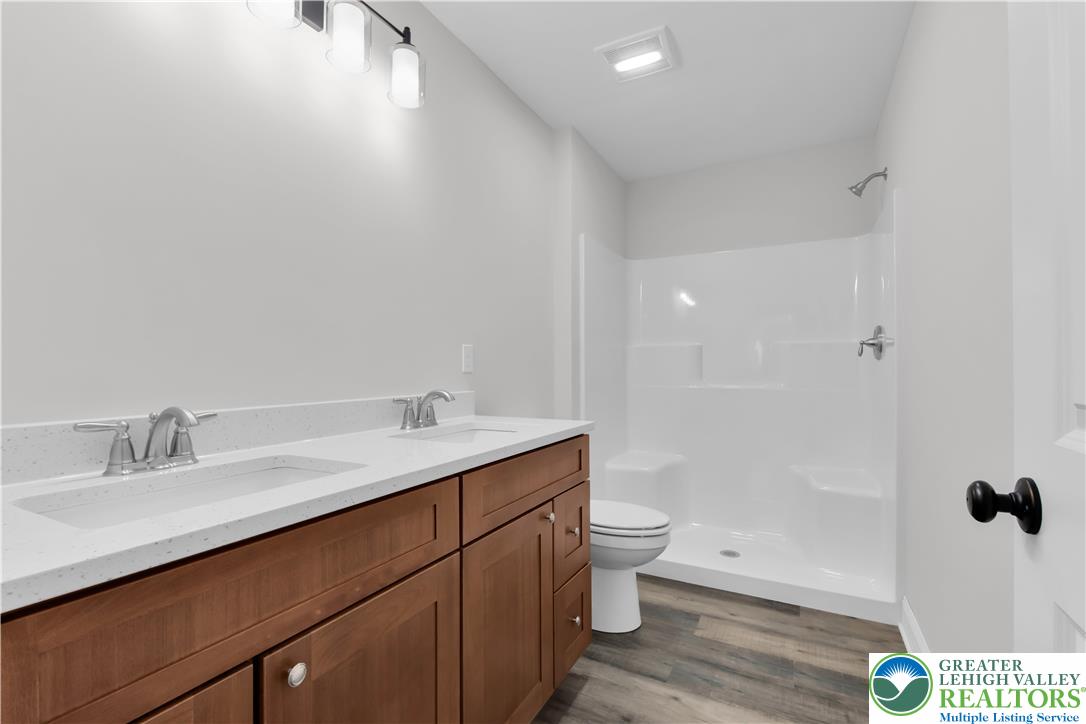 6 West 1st Street Northampton, PA 18067 - Photo 24 of 45 a bathroom with a sink a toilet and shower