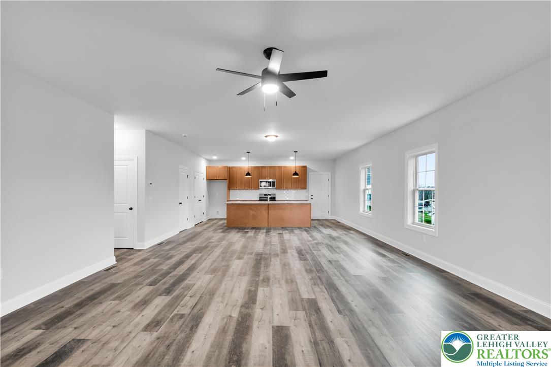 6 West 1st Street Northampton, PA 18067 - Photo 8 of 45 a view of empty room with wooden floor and fan