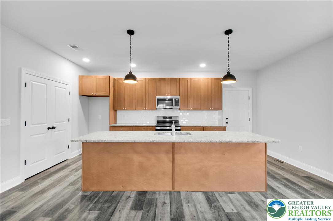 6 West 1st Street Northampton, PA 18067 - Photo 9 of 45 a view of a kitchen with center island and stainless steel appliances