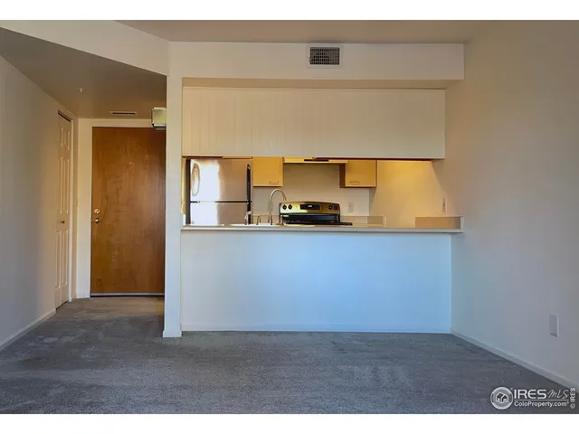 a kitchen with a refrigerator a sink and a sink