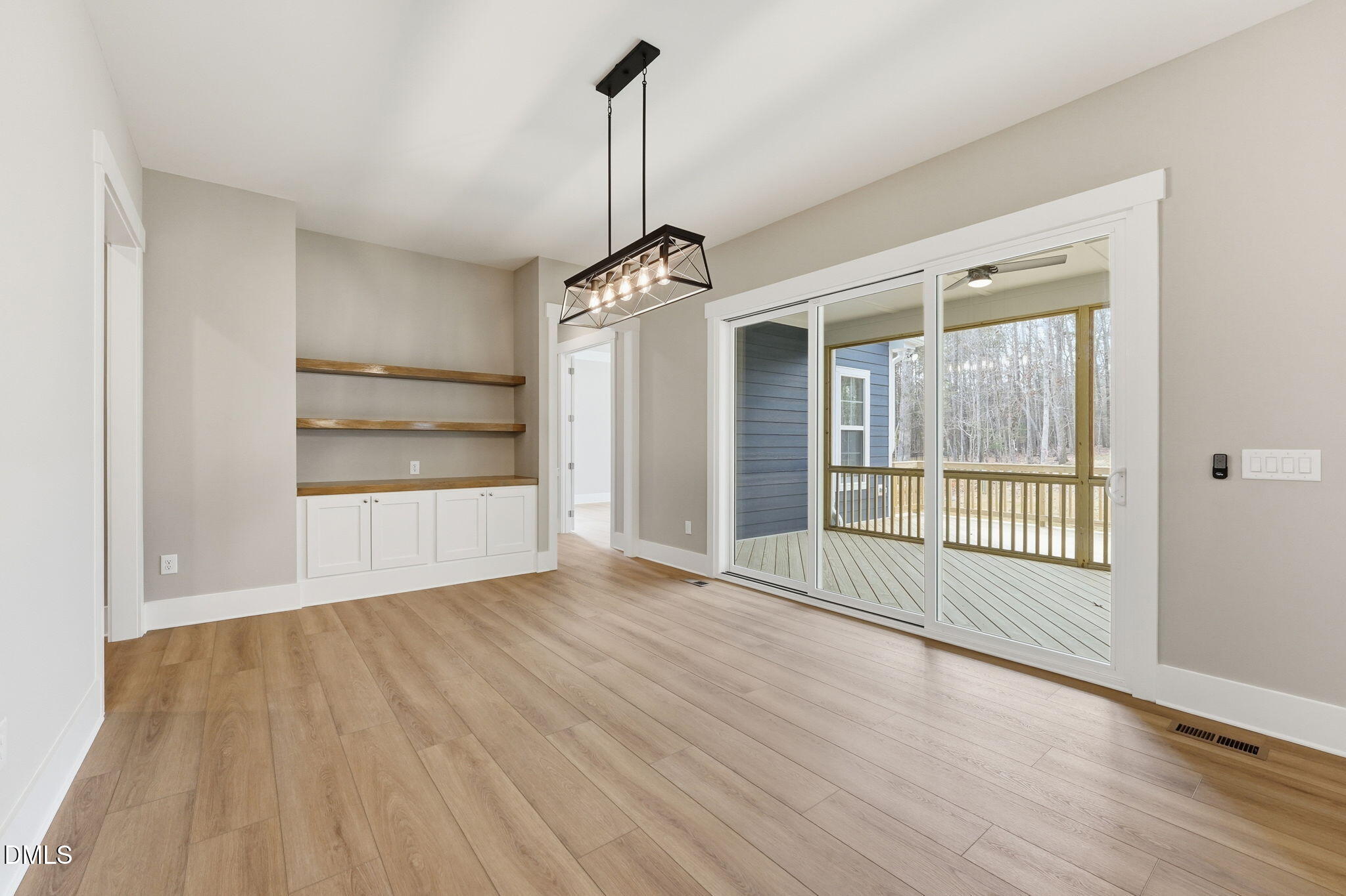318 Ivy Rdg Road Chapel Hill, NC 27516 - Photo 14 of 47 a view of empty room with wooden floor and fan