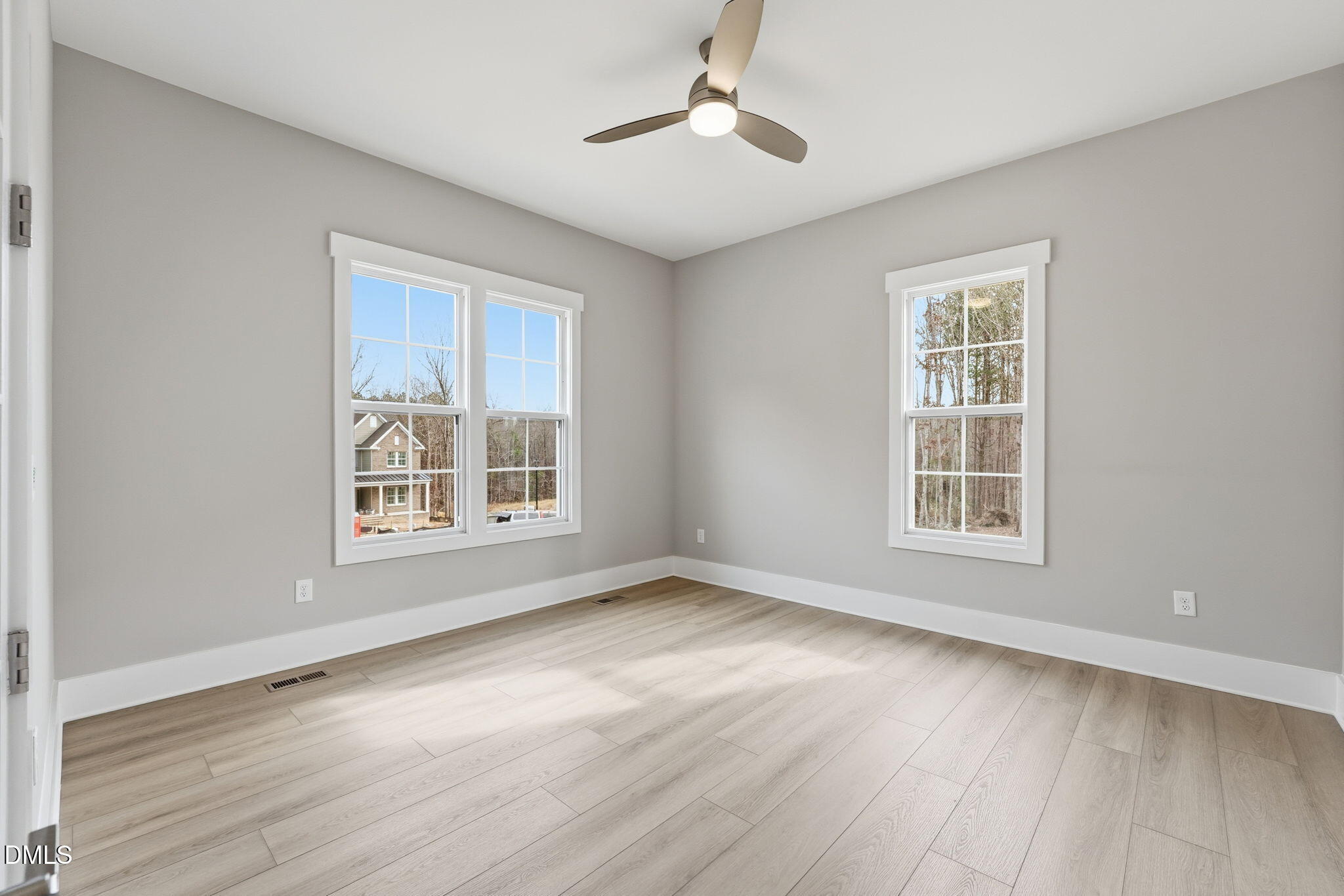 318 Ivy Rdg Road Chapel Hill, NC 27516 - Photo 15 of 47 a view of an empty room with wooden floor and a window