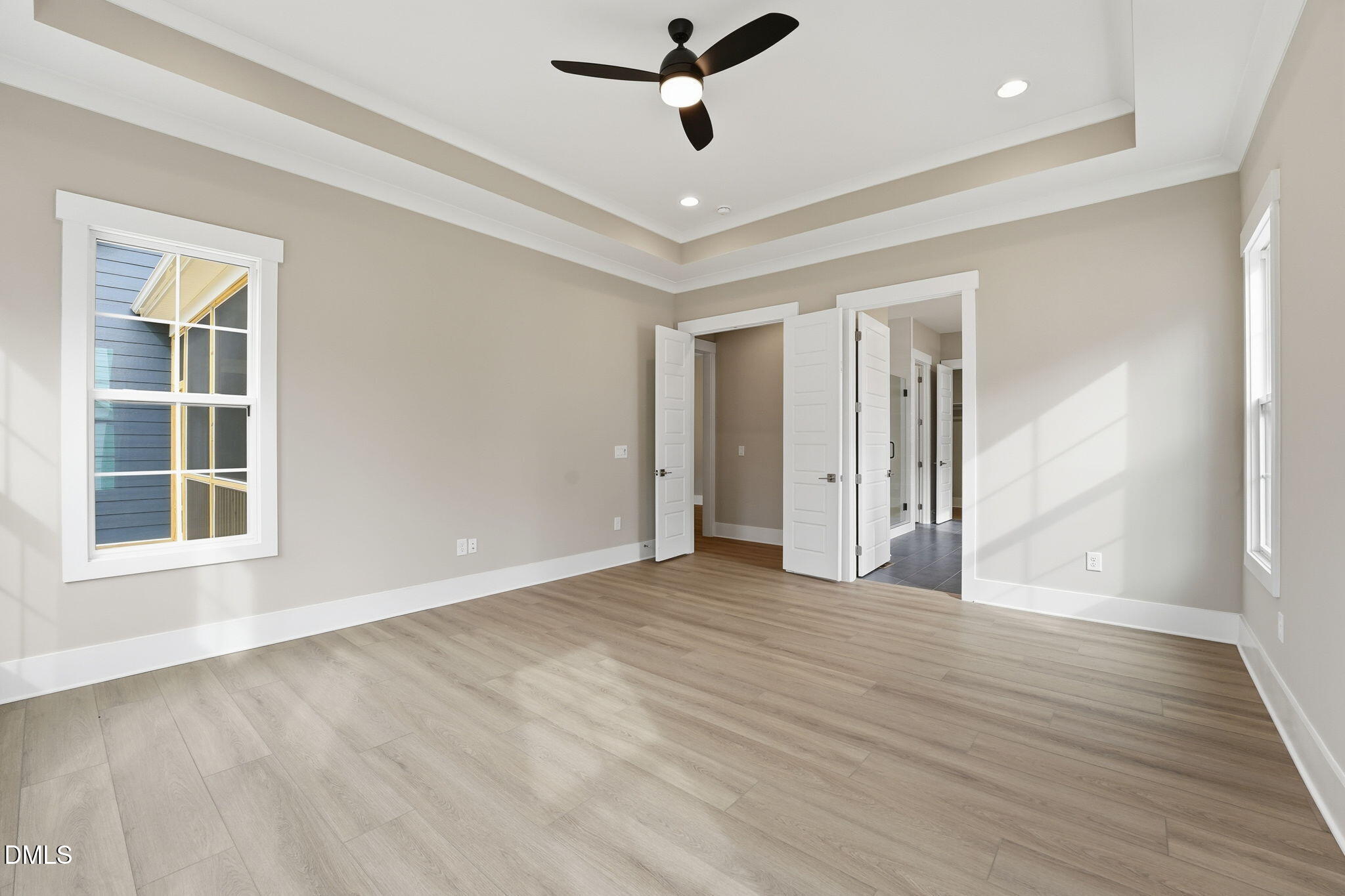 318 Ivy Rdg Road Chapel Hill, NC 27516 - Photo 17 of 47 an empty room with wooden floor and windows