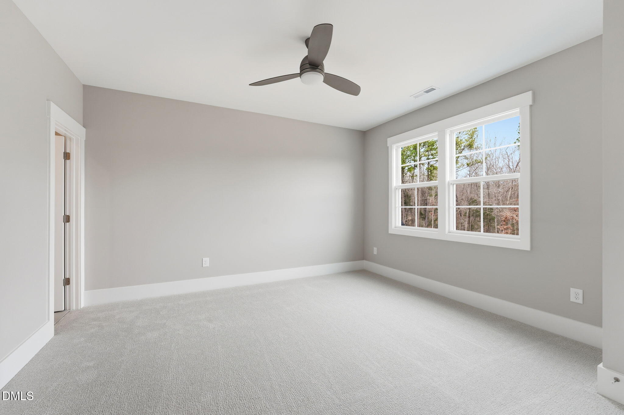 318 Ivy Rdg Road Chapel Hill, NC 27516 - Photo 18 of 47 a view of an empty room with a window