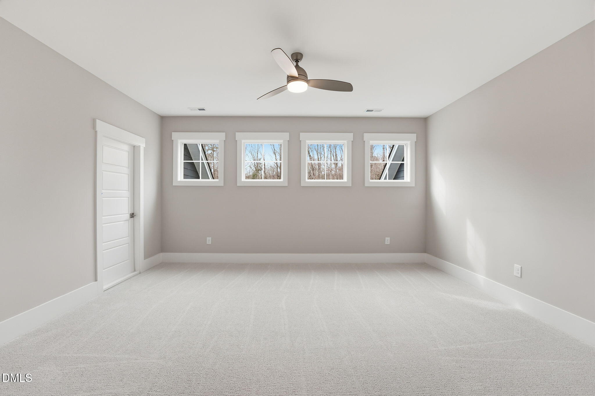 318 Ivy Rdg Road Chapel Hill, NC 27516 - Photo 21 of 47 an empty room with windows and ceiling fan
