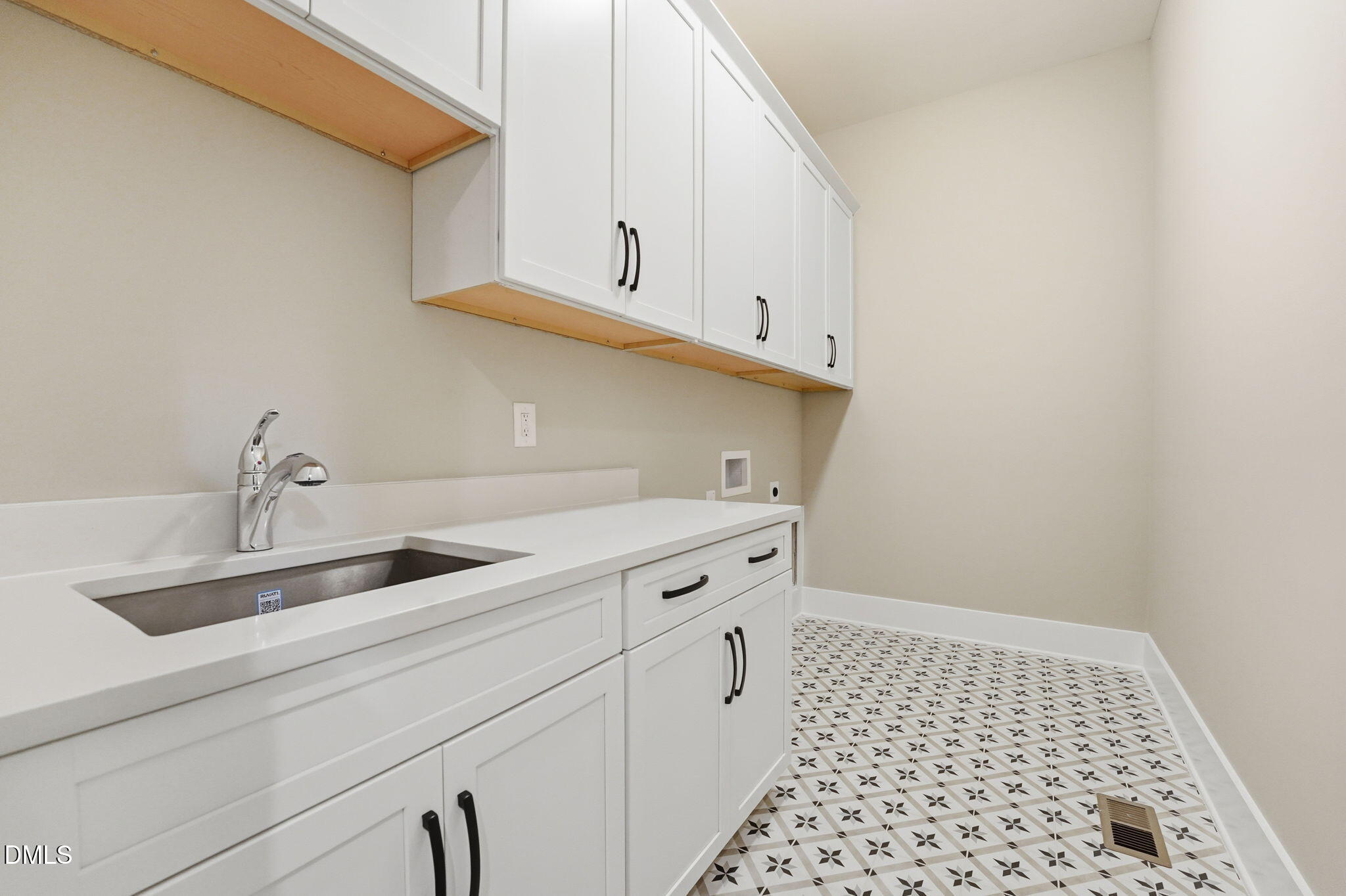 318 Ivy Rdg Road Chapel Hill, NC 27516 - Photo 30 of 47 a kitchen with a sink and cabinets