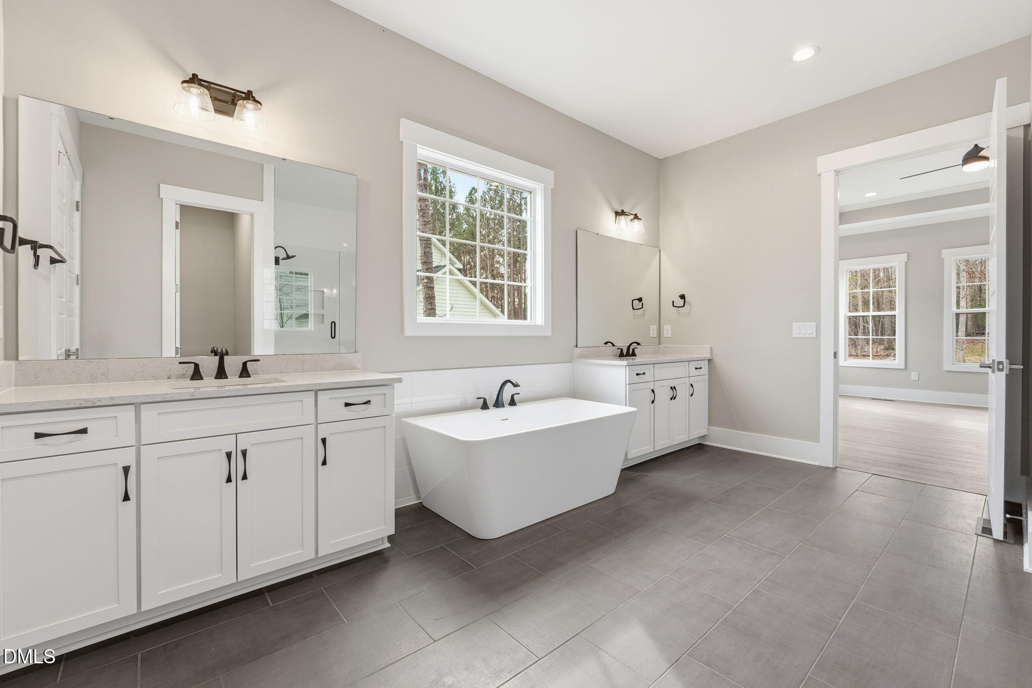 318 Ivy Rdg Road Chapel Hill, NC 27516 - Photo 32 of 47 a bathroom with a bathtub sink double vanity and a mirror